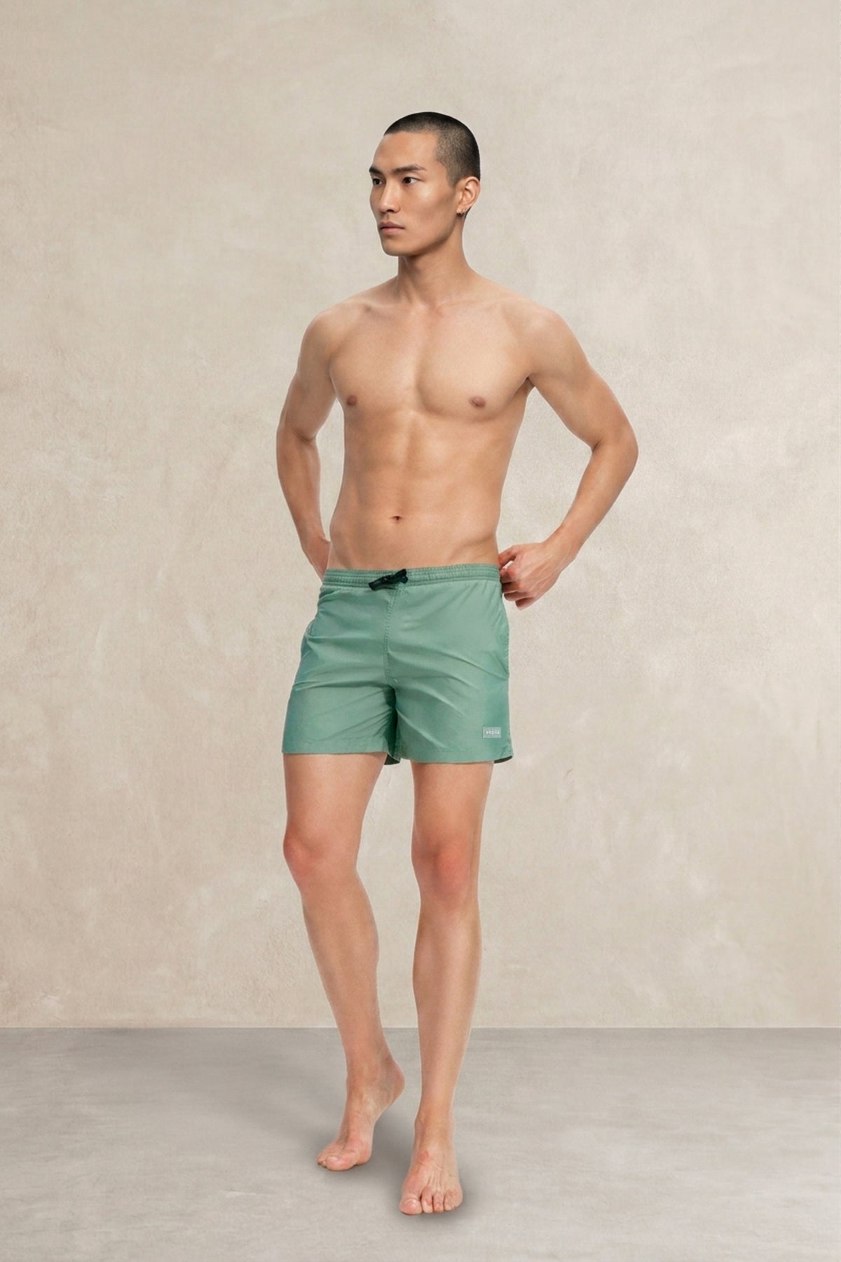 Green swim shorts