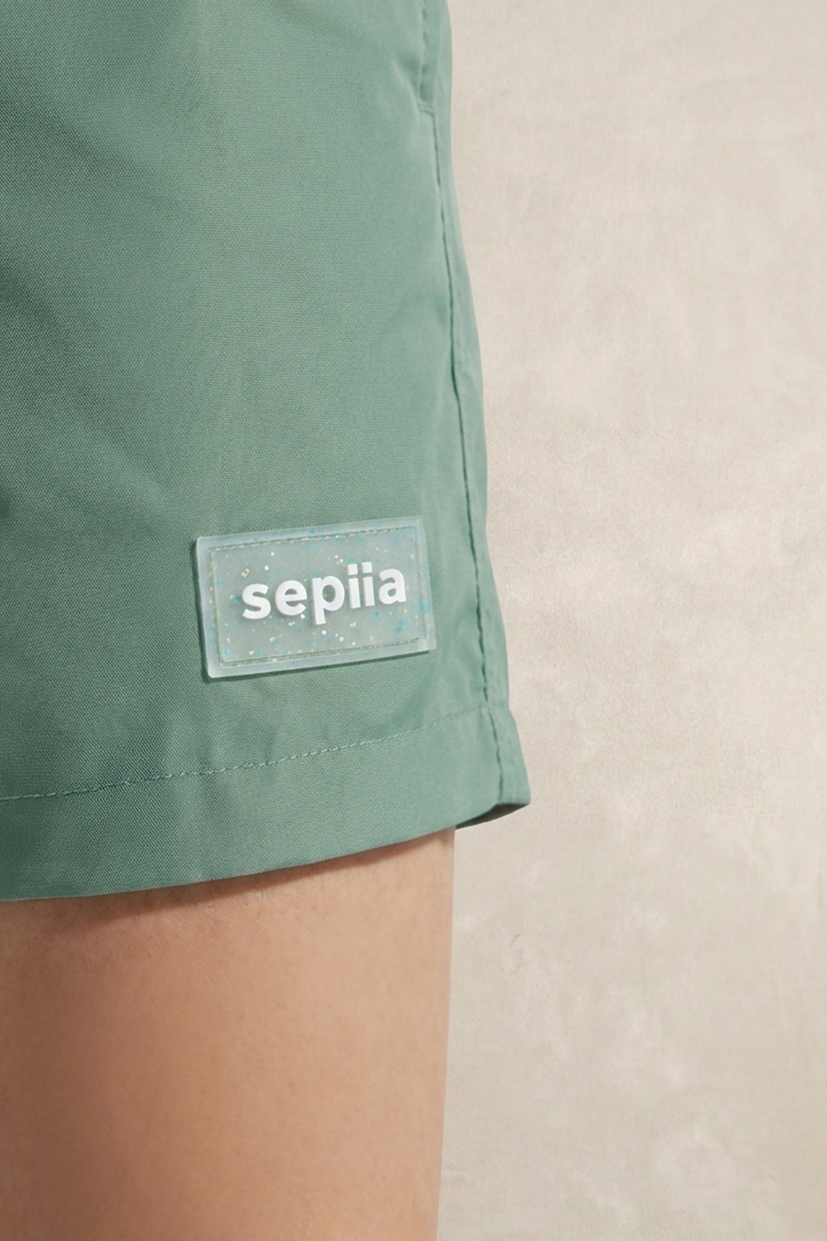 Green swim shorts
